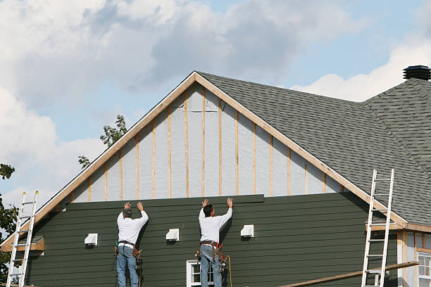 Professional Storm Damage Siding Repair technician working in Afton, MN